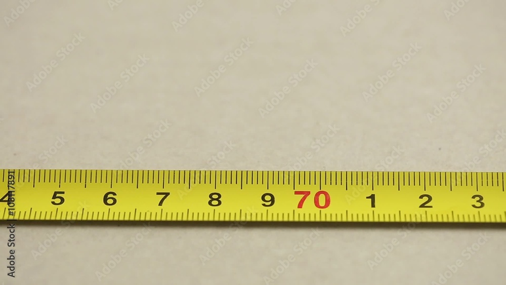 measuring with a tape measure measuring with a tape measure