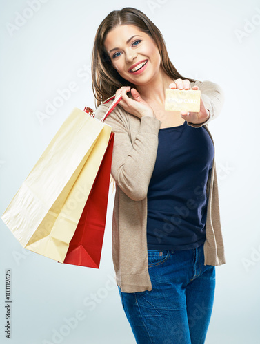 Shopping with credit card. Happy woman hold shopping bag. photo