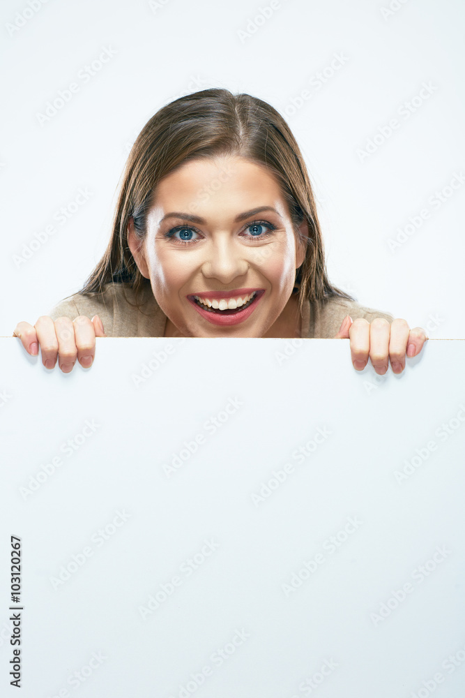 Woman looks out from behind white blank sign board. Woman looks out from behind white blank sign board.