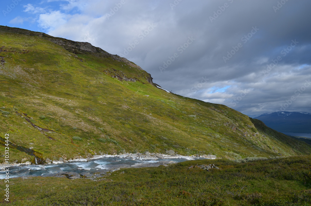 River through valley, mountains and lake Torneträsk, Abisko, subarctic Swedish Lapland River through valley, mountains and lake Torneträsk, Abisko, subarctic Swedish Lapland