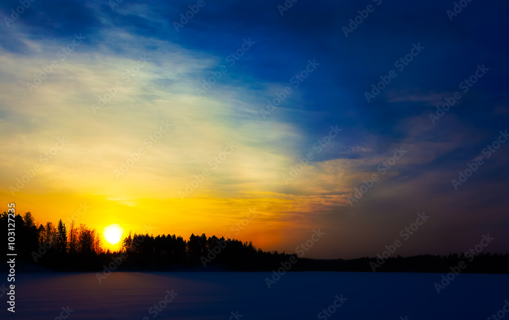 Sunset on the lake in Finland in the winter