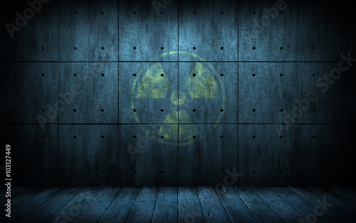industrial grunge background with radiation symbol, dark room with walls of concrete and wooden floor