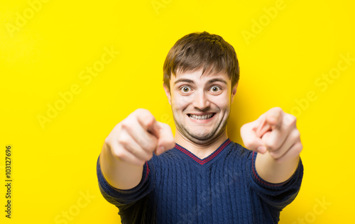 young handsome man showing thumbs up