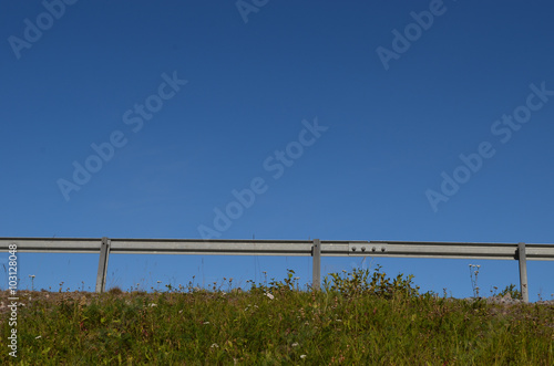 Road guardrail against blue sky  Swedish Lapland