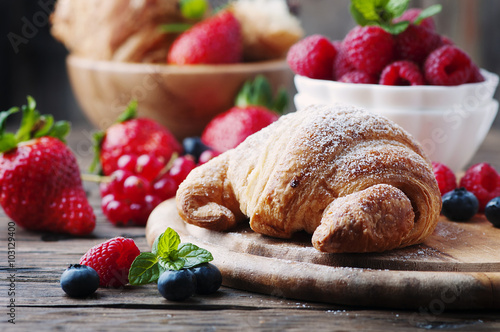 Fresh croissant with mix of berry