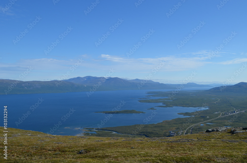 View on valley of lake Torneträsk and village of Abisko, subarctic mountains, Swedish Lapland
