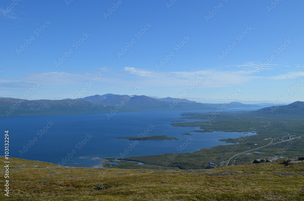 View on valley of lake Torneträsk and village of Abisko, subarctic mountains, Swedish Lapland View on valley of lake Torneträsk and village of Abisko, subarctic mountains, Swedish Lapland