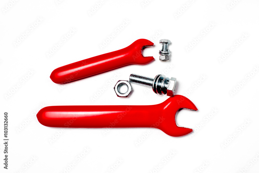 Two Red rubbered tools screw on white surface. Isolated Two Red rubbered tools screw on white surface. Isolated