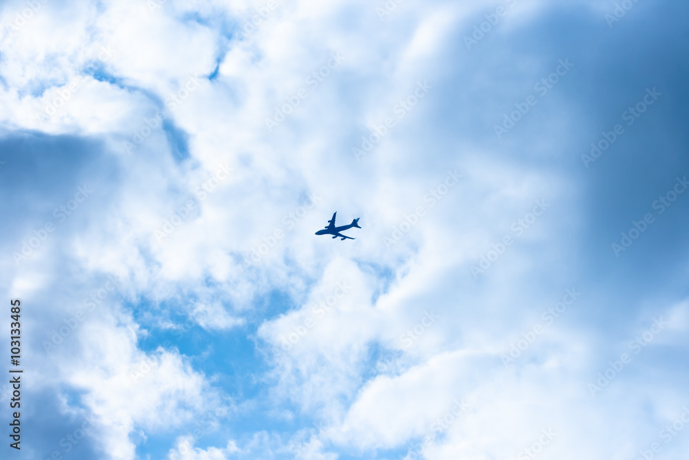 Airplane flies in the blue sky Airplane flies in the blue sky