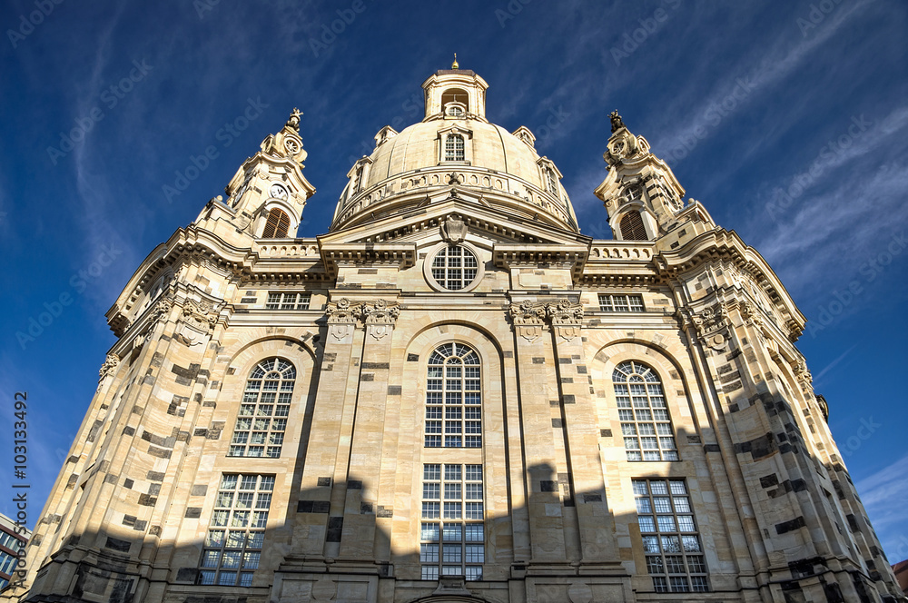 panoramic view of church (Frauenkirche) in Dresden, Saxony, Germany on a sunny day in front of blue sky