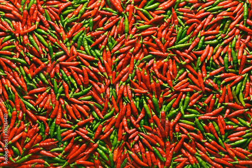 Background image of red and green peppers.
