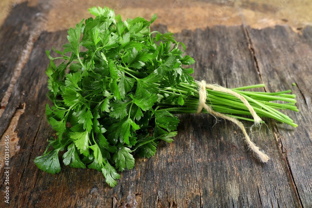 Fresh parsley on wooden background Fresh parsley on wooden background
