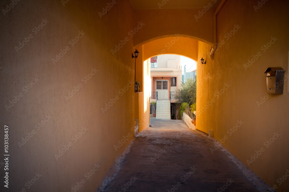 small orange tunnel with a mailbox in an apartment house in Elounda. Crete small orange tunnel with a mailbox in an apartment house in Elounda. Crete