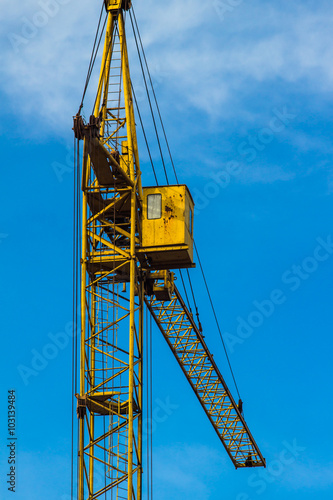 Wallpaper Mural Yellow building crane under blue sky Torontodigital.ca