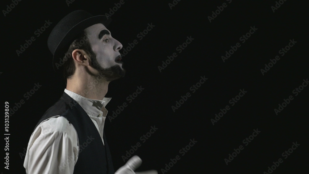 Young funny shouting mime using a megaphone Young funny shouting mime using a megaphone
