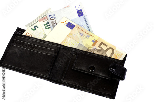 Euro banknotes in nominal value 5, 10, 20 and 50 in black purse.