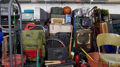 Vintage junk filled garage dolly out shot.  Object brand names and logos were covered.