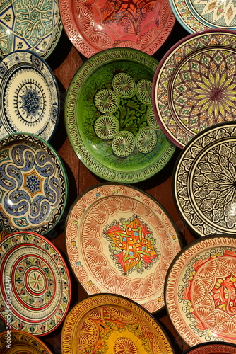 Ornate plates, Marrakech, Morocco, Africa. Pottery glazed plates for the tourism market in the Kasbah.
