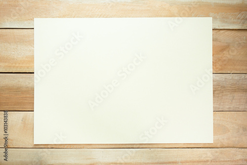 Top view of white paper note on the wood table