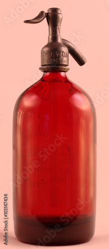 Fotografie Tall red traditional retro vintage Argentinian glass and metal soda syphon bottl