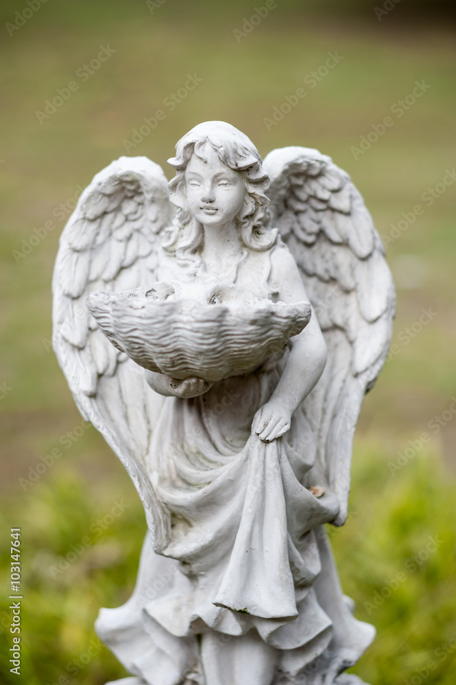 Angel statue in nature place in soft light Angel statue in nature place in soft light