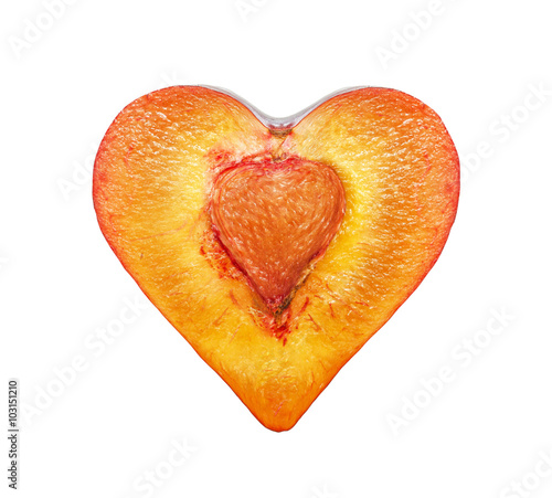 The half of the plums in the form of heart isolated on a white