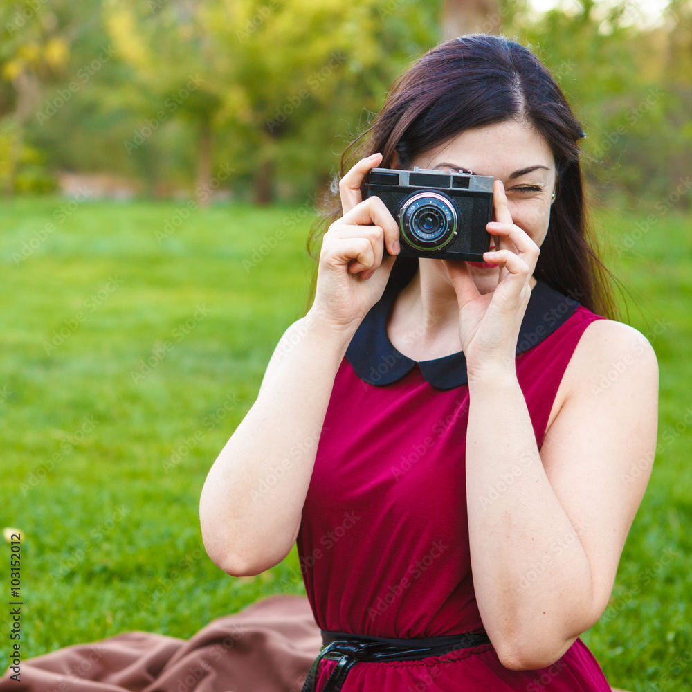 beautiful woman photographed in the park on an old film camera beautiful woman photographed in the park on an old film camera