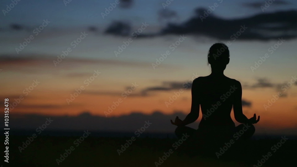 Meditation - Yoga woman meditating at beach sunset or sunrise relaxing in yoga pose. Serene relaxed female yoga instructor in calm nature sea scene. Meditation - Yoga woman meditating at beach sunset or sunrise relaxing in yoga pose. Serene relaxed female yoga instructor in calm nature sea scene.