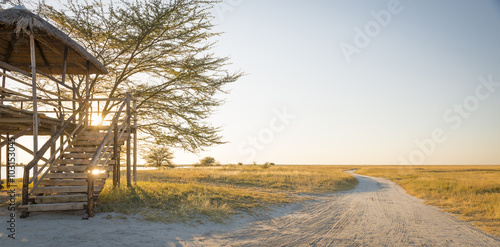 Wooden viewing hut with thatched roof looking out over the Makgadikgadi Pan in Botswana, Africa while on safari