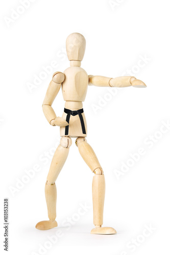 Karate man with black belt isolated over white background. Abstract image with a wooden puppet