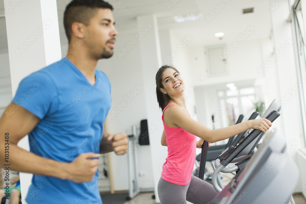 Young multiracial people training in the gym Young multiracial people training in the gym