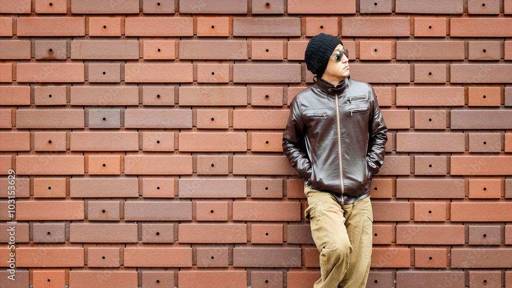 An Asian Man in a Brown Jacket An Asian Man in a Brown Jacket