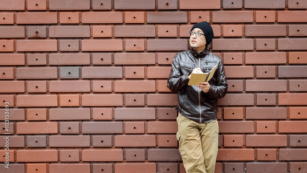 An Asian Man in a Brown Jacket An Asian Man in a Brown Jacket