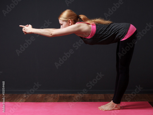  Yoga. Young blonde woman doing yoga exercise photo