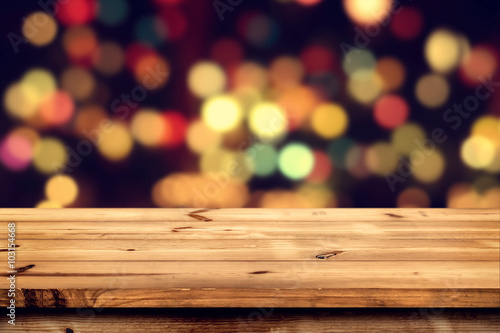 Empty wooden table for product placement or montage with focus to the table top  blurred bokeh background .