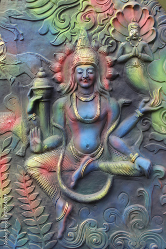 God of mythology sculpture on entrance.