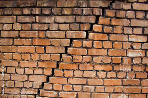 Large crack in the wall of brick