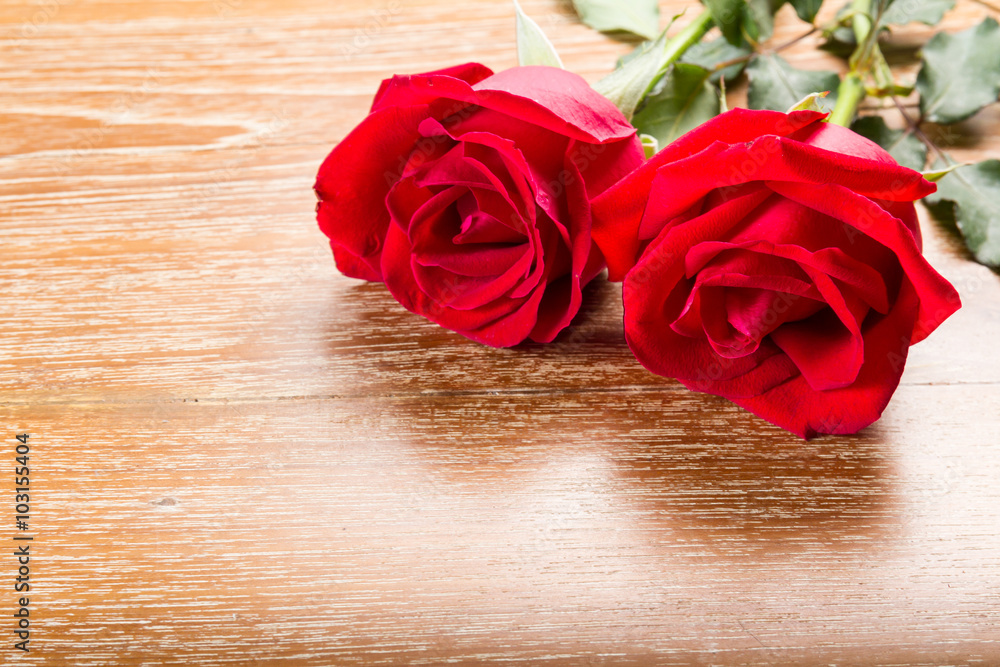 red rose on wooden background red rose on wooden background