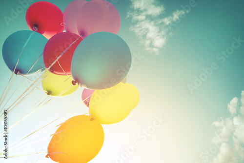Multicolor balloons in summer holidays. Pastel color filter