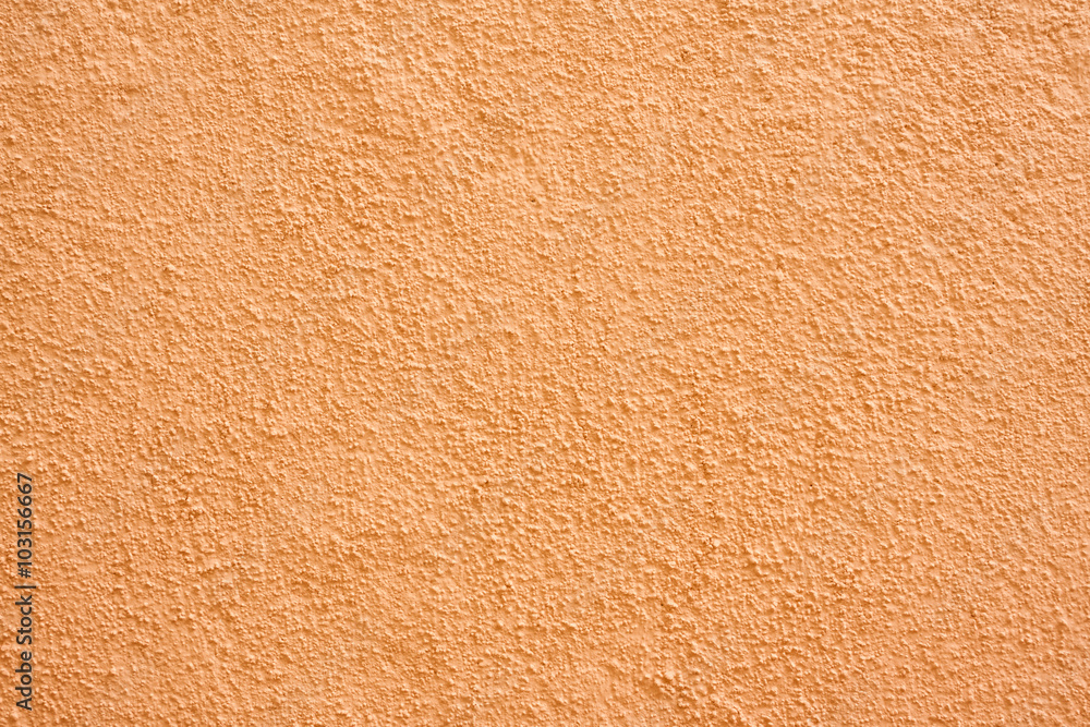 Stucco wall - Orange stucco textured wall background with natural light. Stucco wall - Orange stucco textured wall background with natural light.