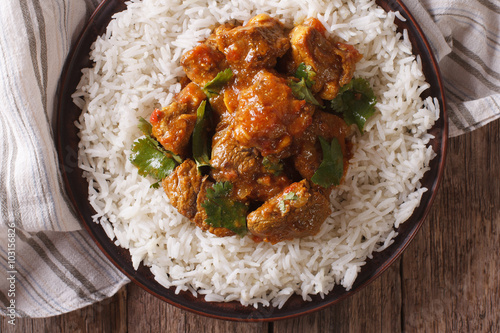 beef madras with basmati rice close-up on a plate. horizontal top view
 photo