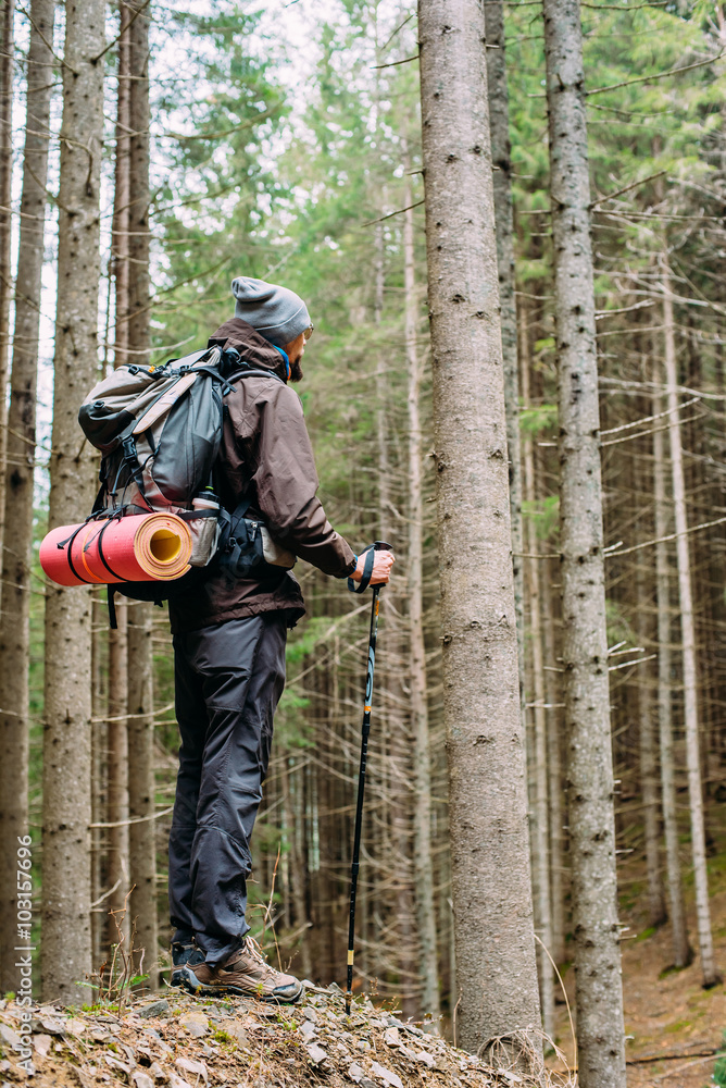 caucasian male hiking in mountains