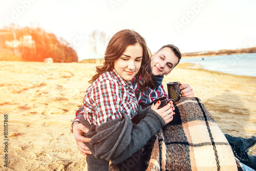 Young happy couple outdoor on the beach