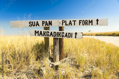 Makgadikgadi Pan sign in Botswana, Africa pointing to the huge salt flats of the Makgadikgadi Pan photo