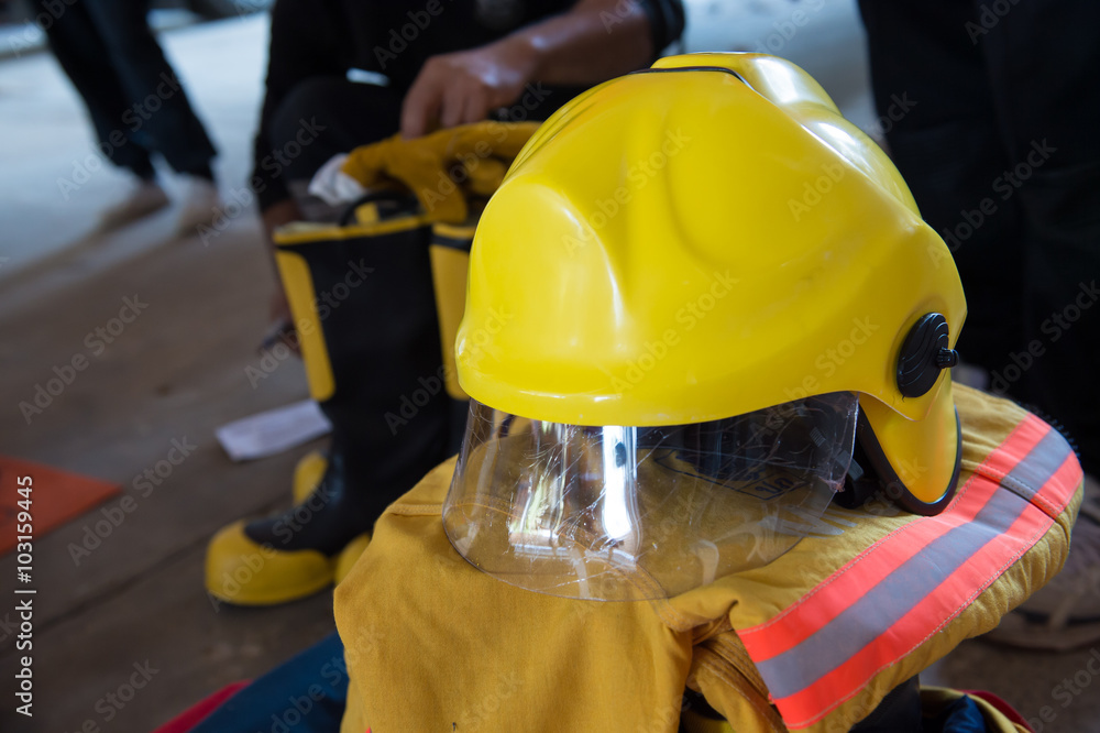 Empty firefighter's boots, helmet and uniform Empty firefighter's boots, helmet and uniform