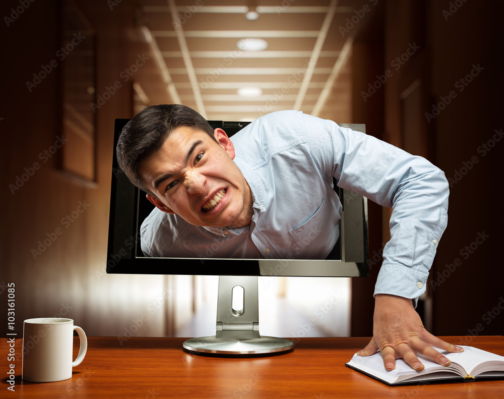 Angry businessman from the screen Angry businessman from the screen