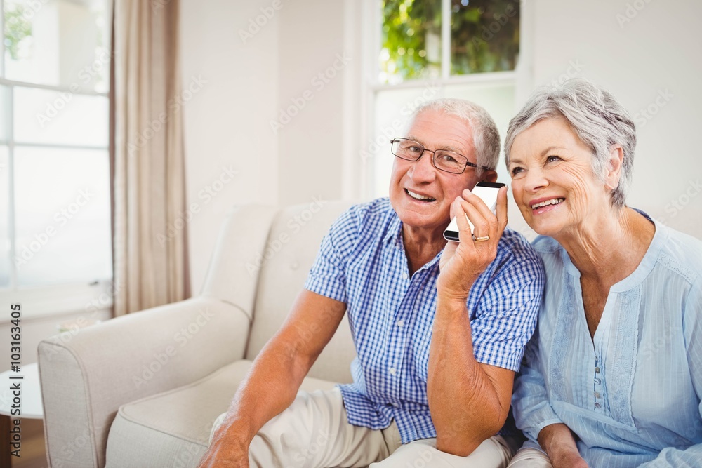 Senior couple talking on mobile phone Senior couple talking on mobile phone