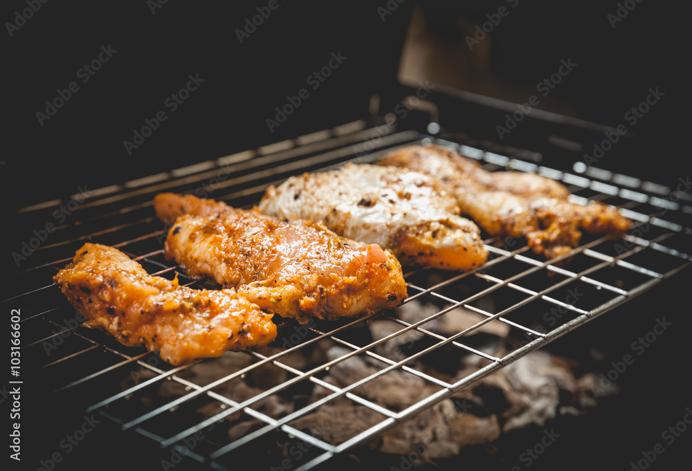 Grilled chicken with black pepper on a barbecue. Vintage style. Grilled chicken with black pepper on a barbecue. Vintage style.