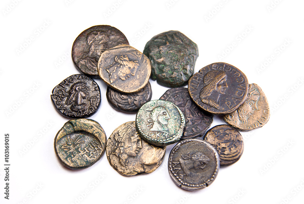 Vintage coins with portraits of kings on over white