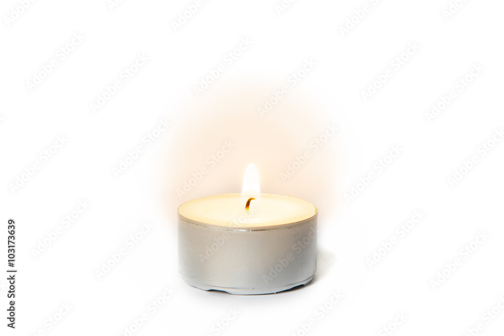 Shining flame on a tea light candle Shining flame on a tea light candle